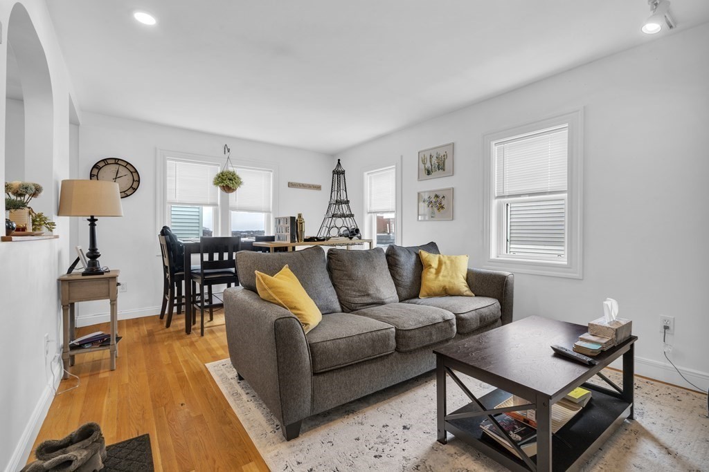 493-495 East 7th Street Boston, MA 02127 - Photo 9 of 22 a living room with furniture and wooden floor