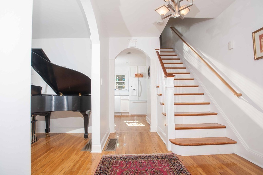 16 Summit Road Wellesley, MA 02482 - Photo 3 of 23 a view of entryway and hall with wooden floor