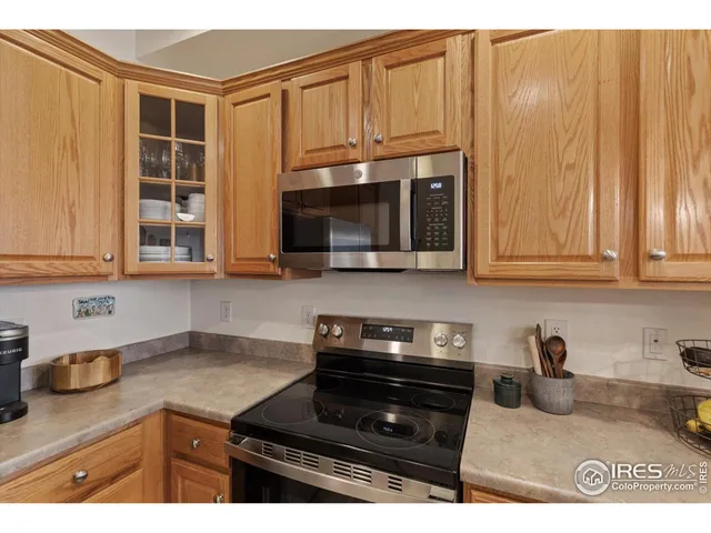 a kitchen with granite countertop a stove and a sink