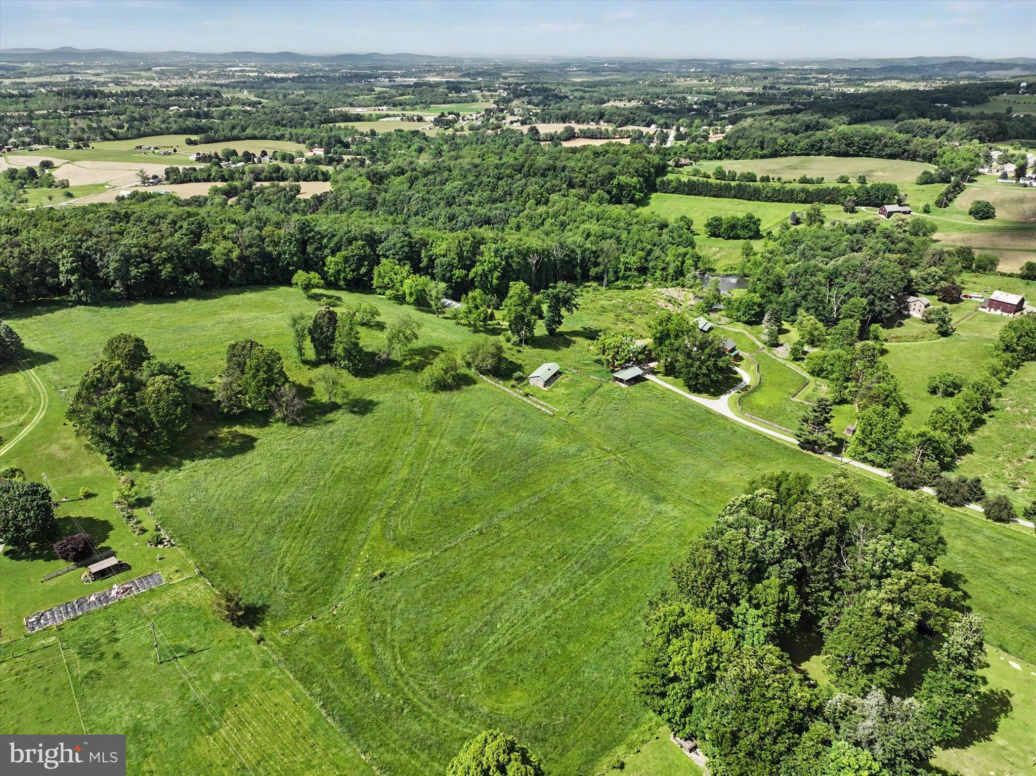 4941 Walters Hatchery Road Spring Grove, PA 17362 - Photo 70 of 71 an aerial view of green landscape with trees houses and mountain view