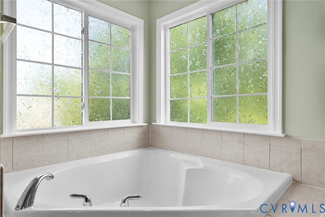 753 Blossom Tree Road Culpeper, VA 22701 - Photo 59 of 68 White corner soaking tub with chrome fixtures, sur