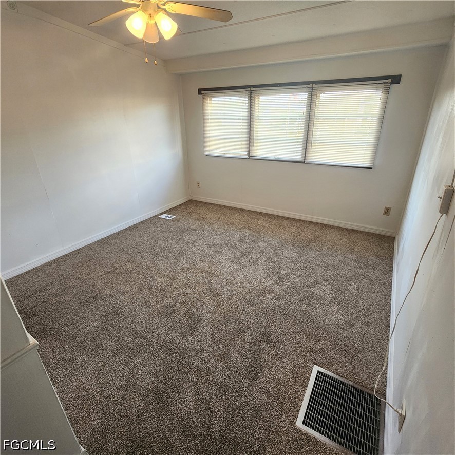 110 Gaslight Avenue North Fort Myers, FL 33917 - Photo 12 of 22 an empty room with a window