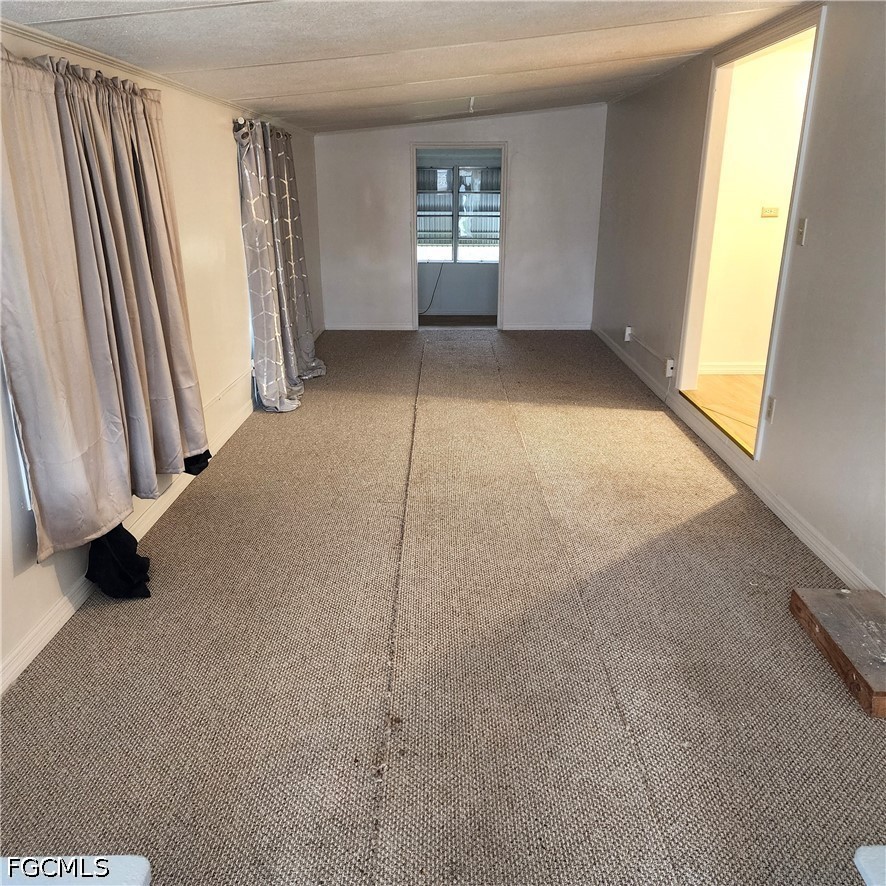110 Gaslight Avenue North Fort Myers, FL 33917 - Photo 6 of 22 an empty room with windows