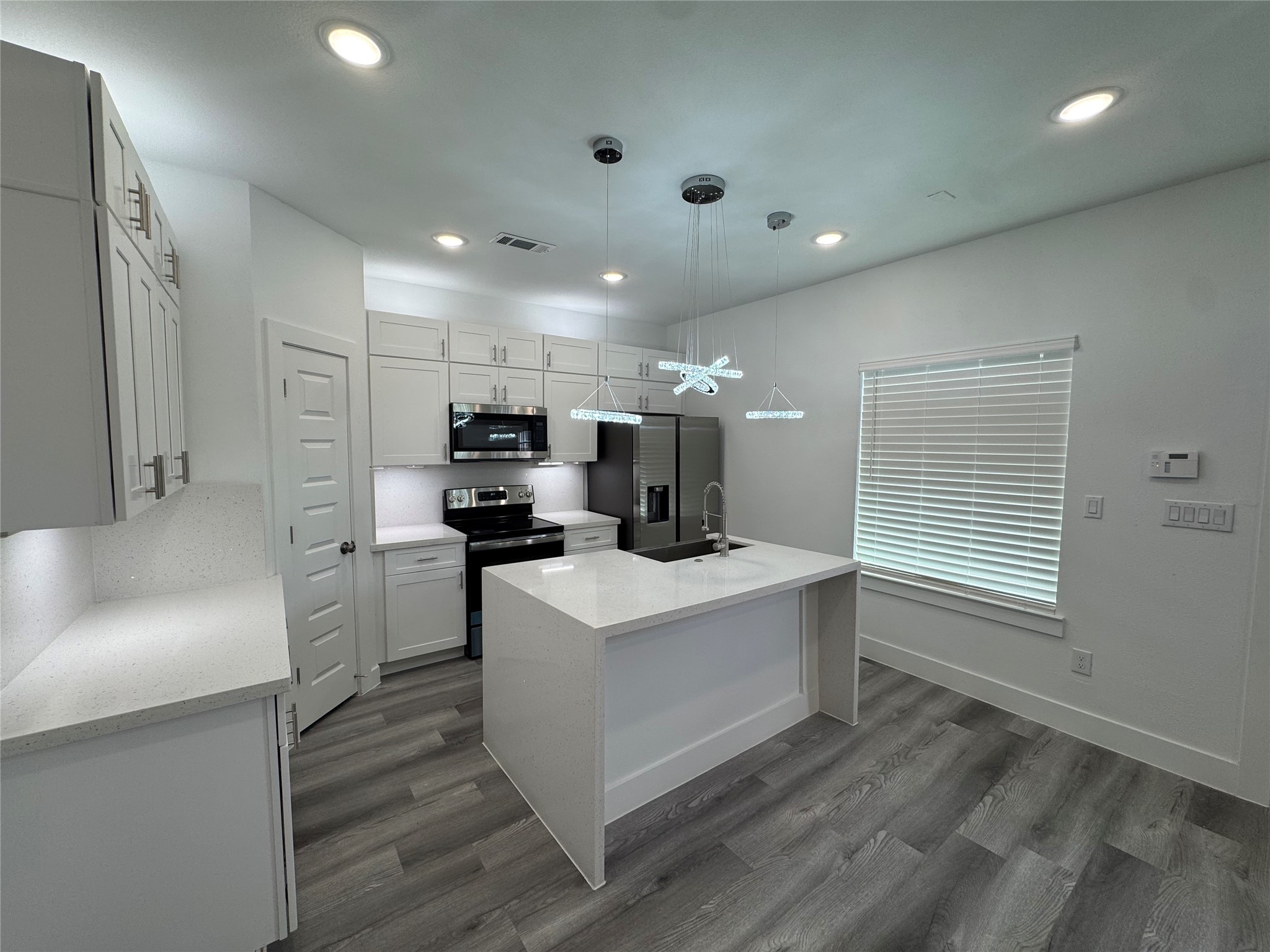 4604 Bricker Street, Unit A Houston, TX 77051 - Photo 5 of 15 a living room with stainless steel appliances kitchen island granite countertop a sink and a refrigerator