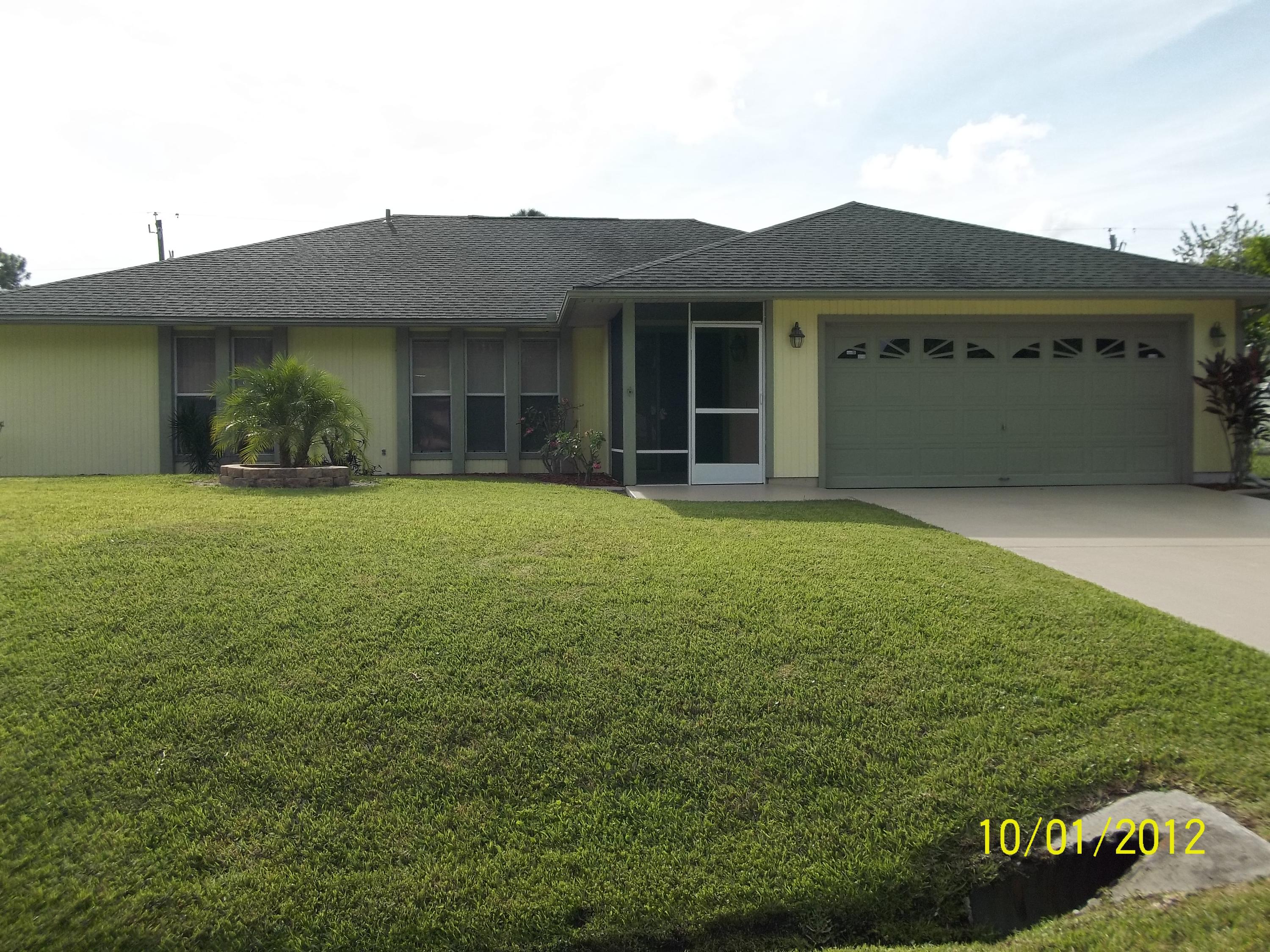 1057 Southwest Fenway Road Port St. Lucie, FL 34953 - Photo 1 of 21 front view