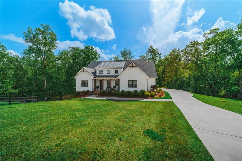 392 London Road Ball Ground, GA 30107 - Photo 7 of 53 a view of a house with garden