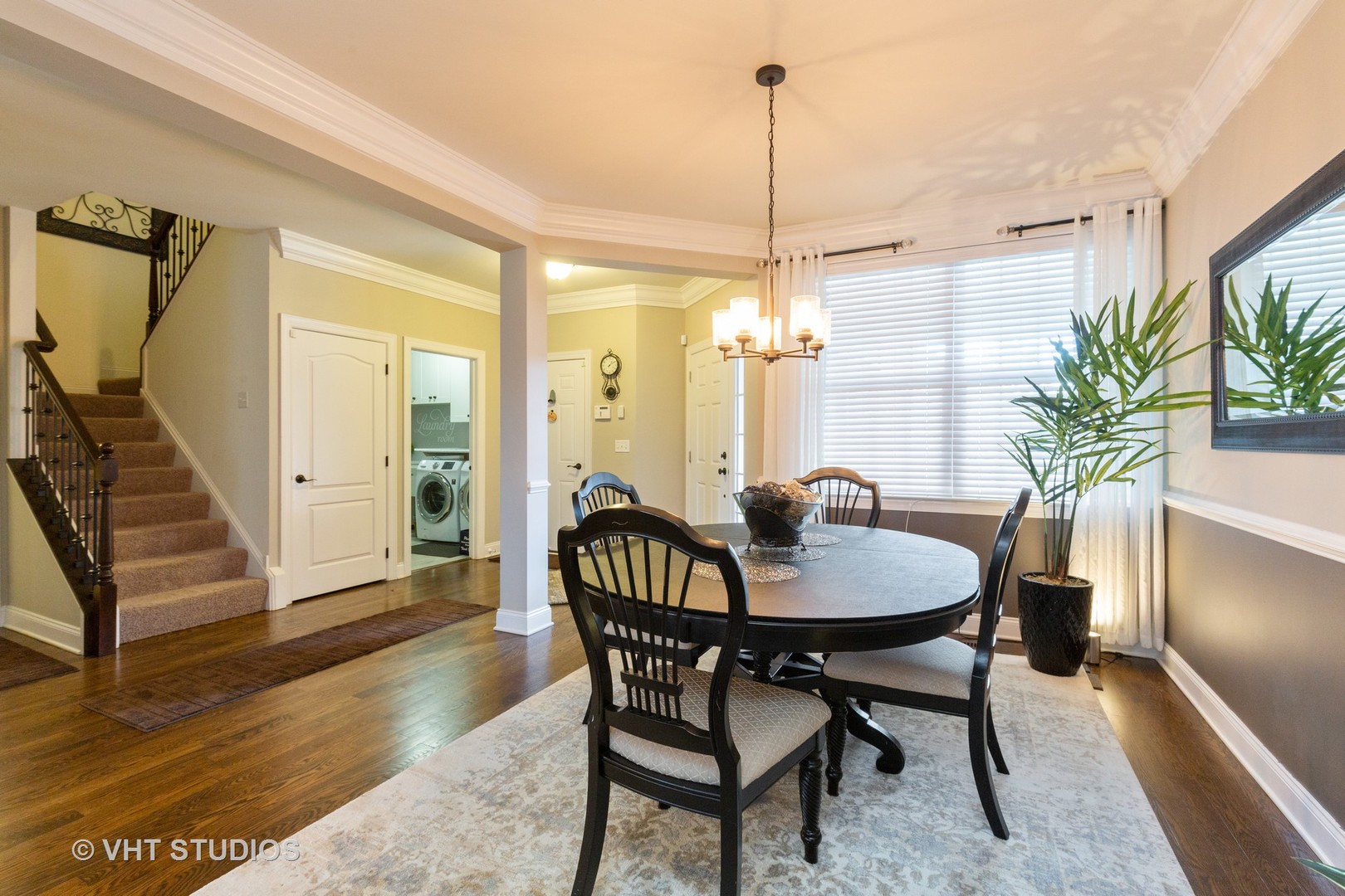 1175 Falcon Ridge Drive, Unit 1175 Elgin, IL 60124 - Photo 2 of 17 a view of a dining room with furniture window and wooden floor
