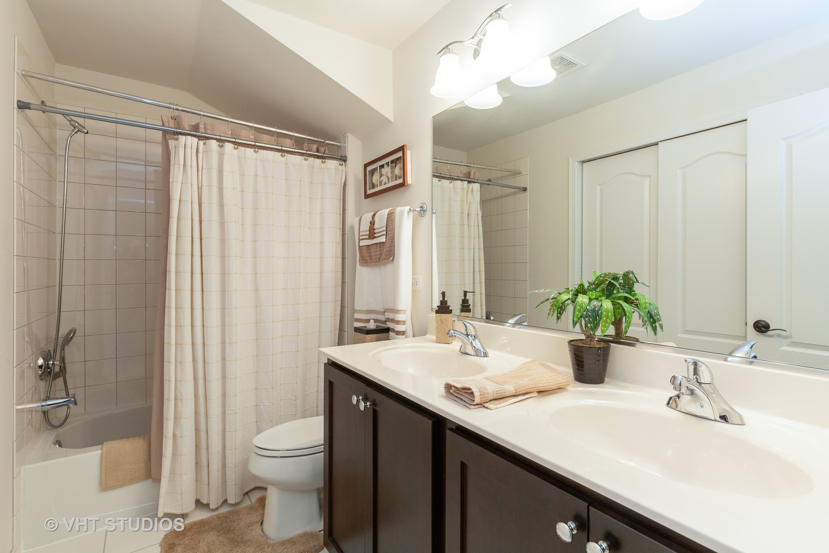 1175 Falcon Ridge Drive, Unit 1175 Elgin, IL 60124 - Photo 7 of 17 a bathroom with a sink a toilet and shower