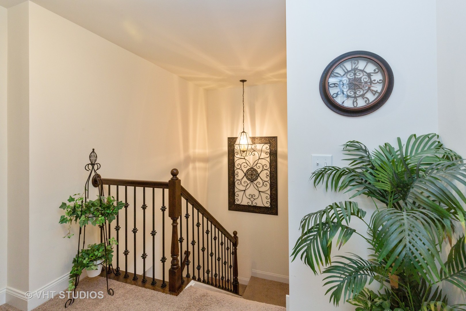 1175 Falcon Ridge Drive, Unit 1175 Elgin, IL 60124 - Photo 10 of 17 a view of a hallway with paintings on the wall