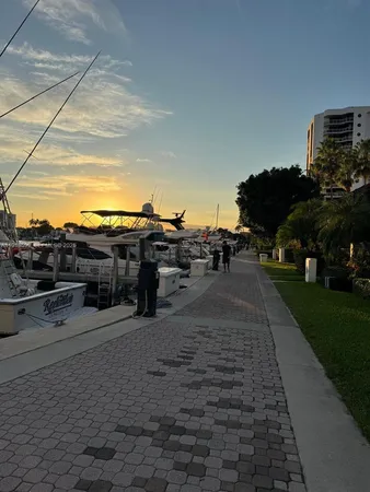 a view of a terrace with lawn chairs