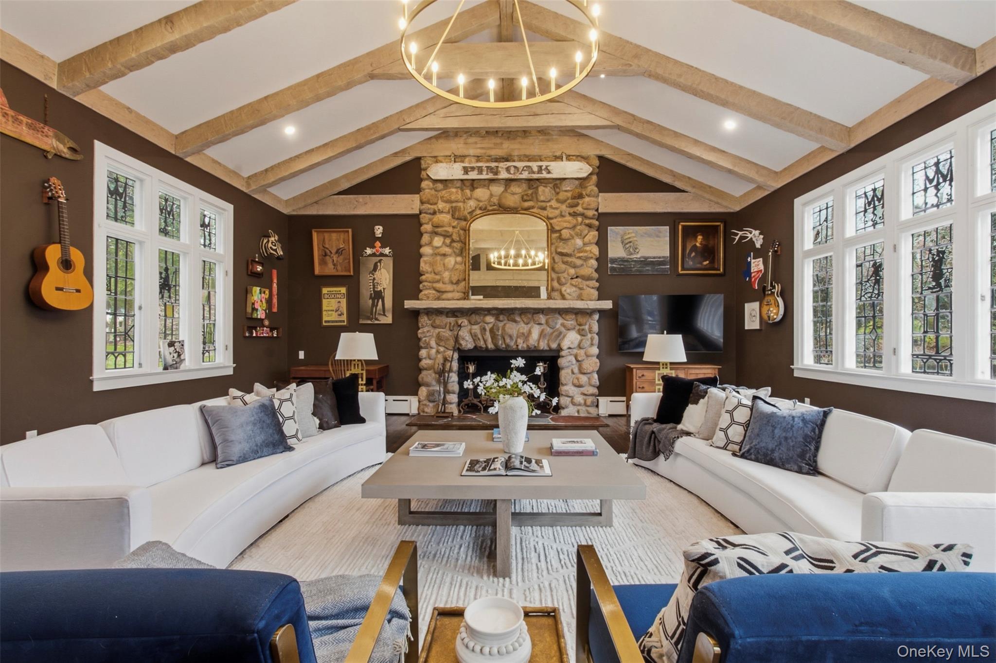 9 Rye Road Rye, NY 10580 - Photo 4 of 50 Oversized family room with soaring vaulted cathedral ceilings and a wood-burning fireplace.