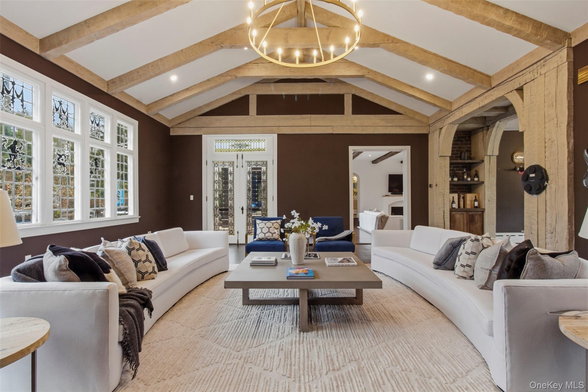 9 Rye Road Rye, NY 10580 - Photo 5 of 50 Oversized family room with soaring vaulted cathedral ceilings and a wood-burning fireplace.