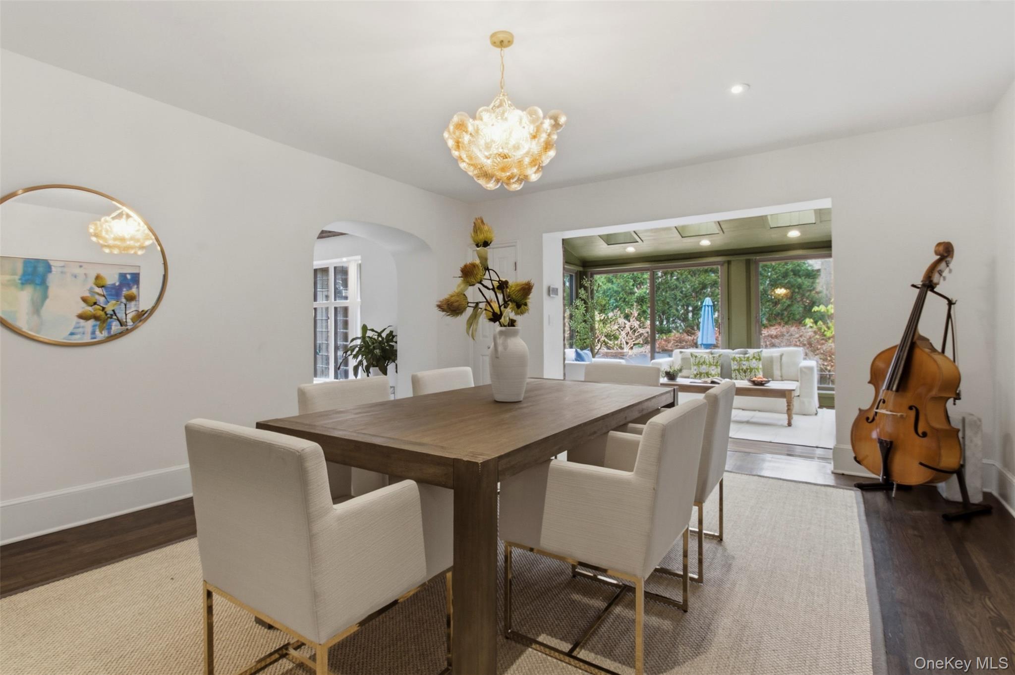 9 Rye Road Rye, NY 10580 - Photo 8 of 50 Formal dining room flowing seamlessly into the sunroom.