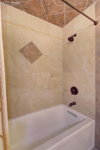 17879 Pinon Park Road Peyton, CO 80831 - Photo 17 of 26 Main level full bath has tiled bath.