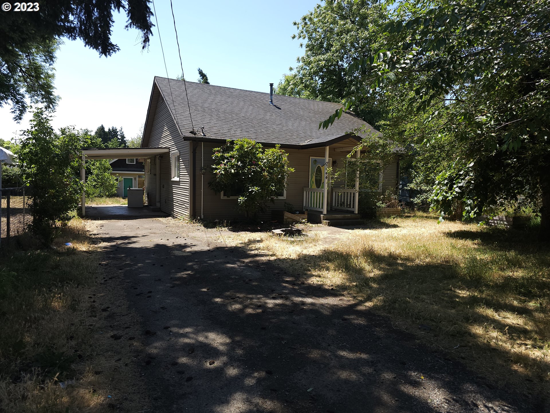 a view of house with yard