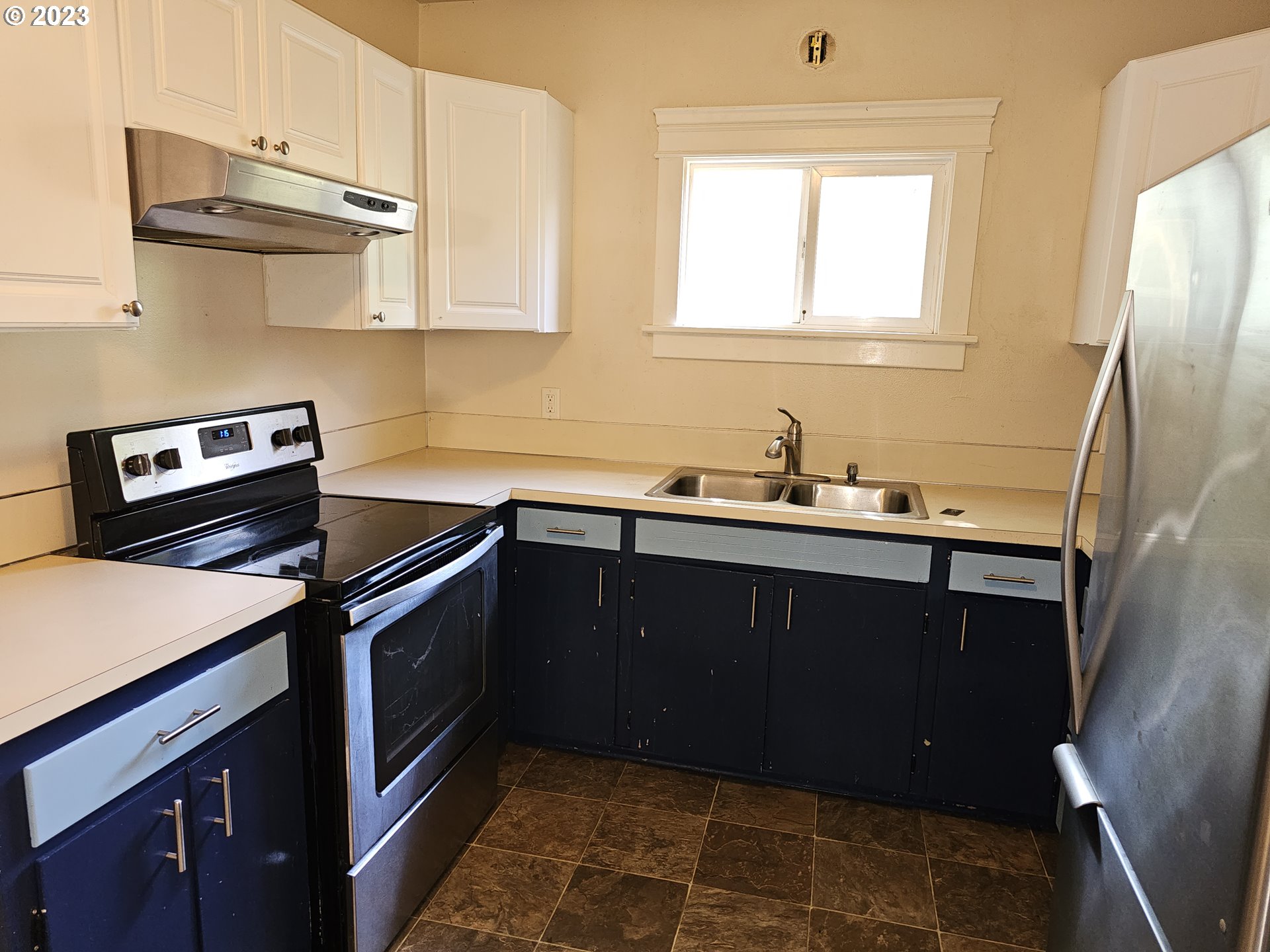 2644 Edison Street Eugene, OR 97402 - Photo 11 of 29 a kitchen with a sink a stove and cabinets