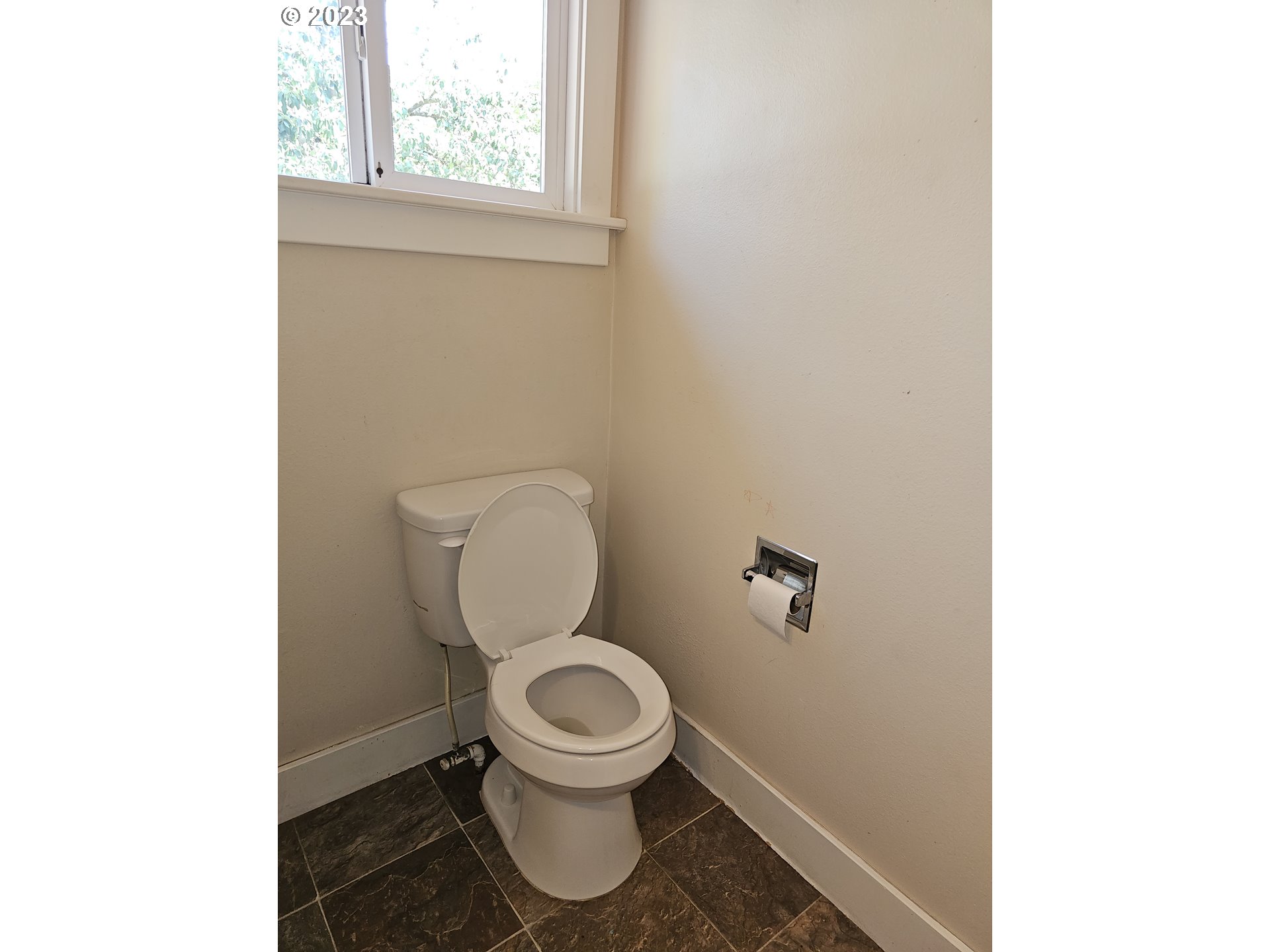 2644 Edison Street Eugene, OR 97402 - Photo 19 of 29 a white toilet sitting in a bathroom next to a window