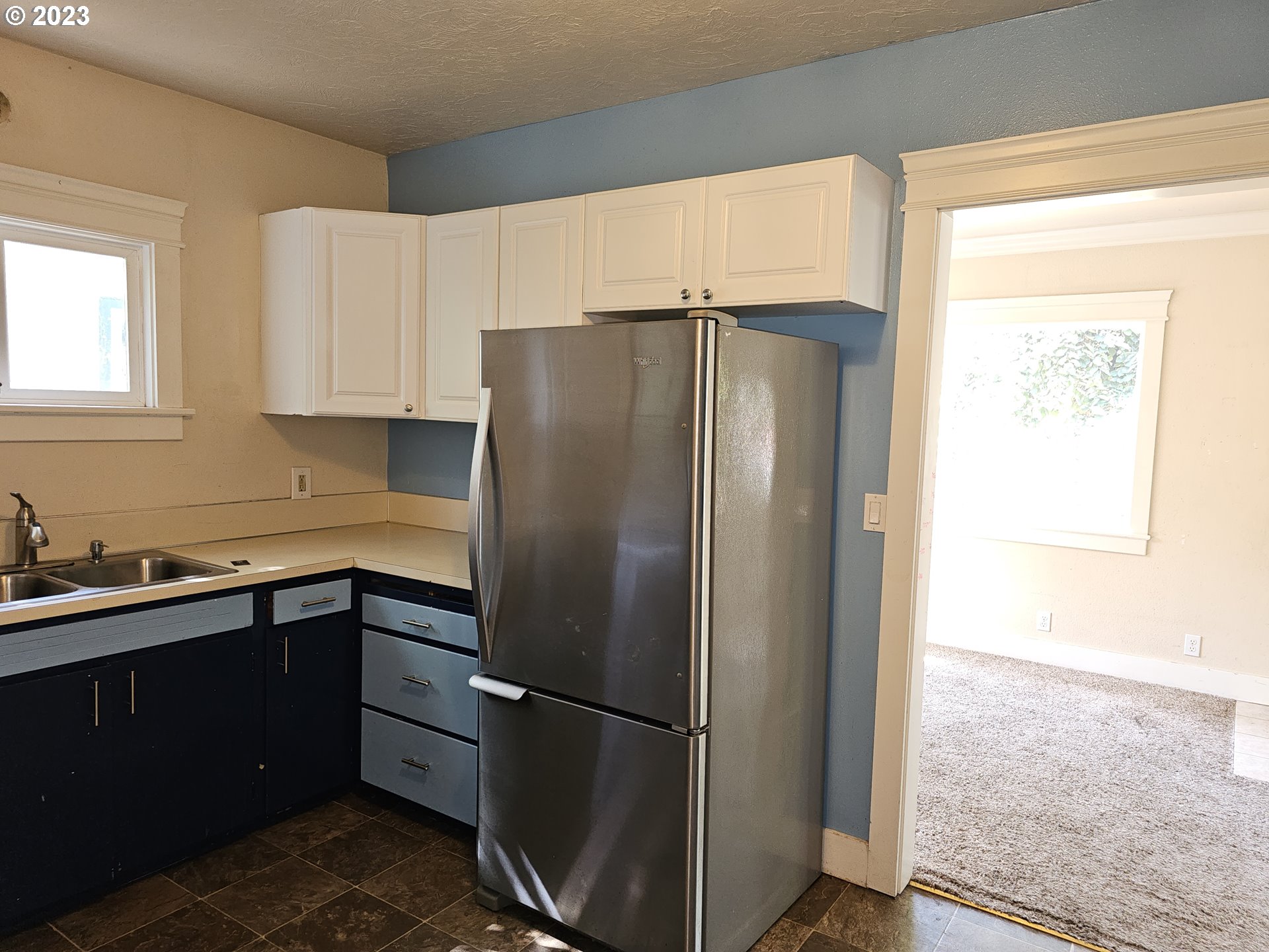 2644 Edison Street Eugene, OR 97402 - Photo 10 of 29 a kitchen with stainless steel appliances a refrigerator sink and cabinets
