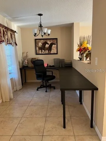 a workspace with furniture and window