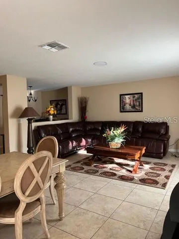 a living room with furniture and rug