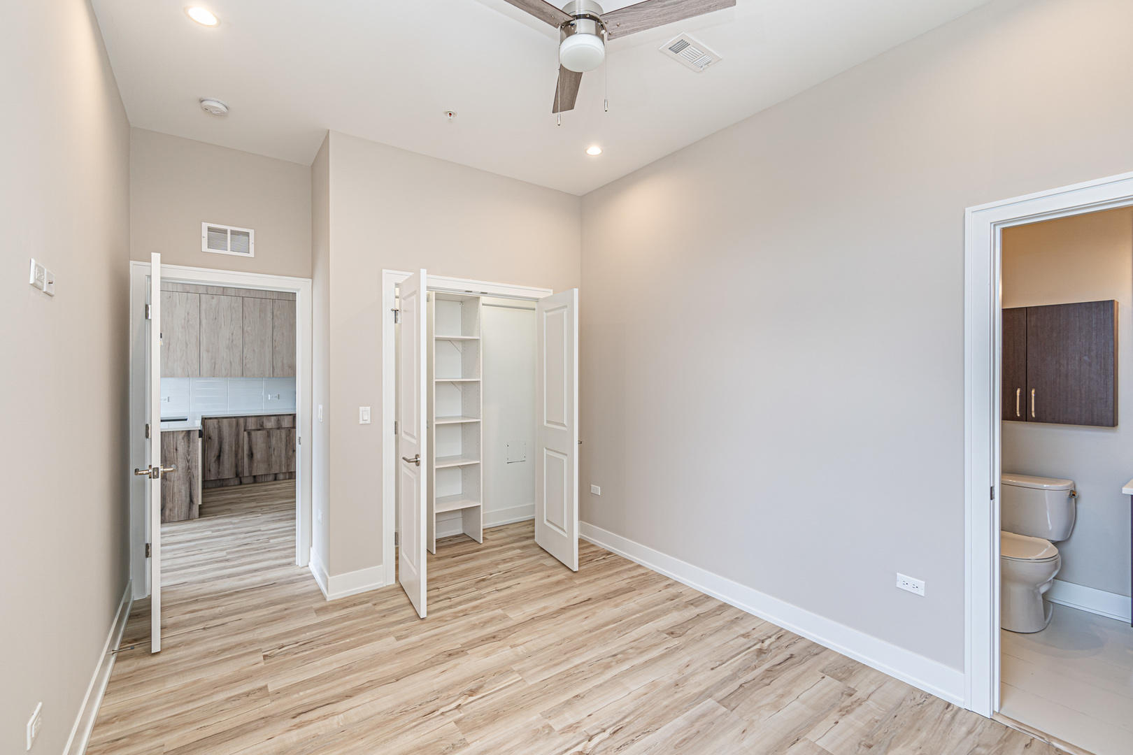 4149 South Cottage Grove Avenue, Unit 305 Chicago, IL 60653 - Photo 15 of 27 a view of a room with wooden floor and a bathroom