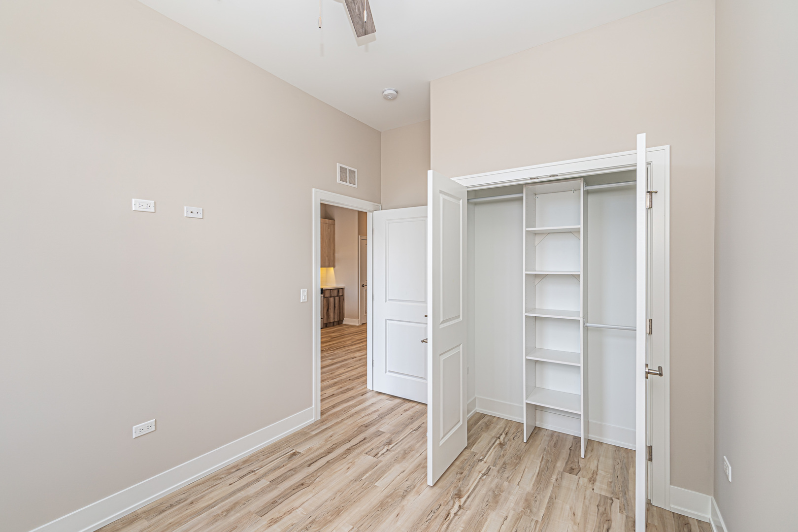4149 South Cottage Grove Avenue, Unit 305 Chicago, IL 60653 - Photo 16 of 27 a view of empty room with wooden floor