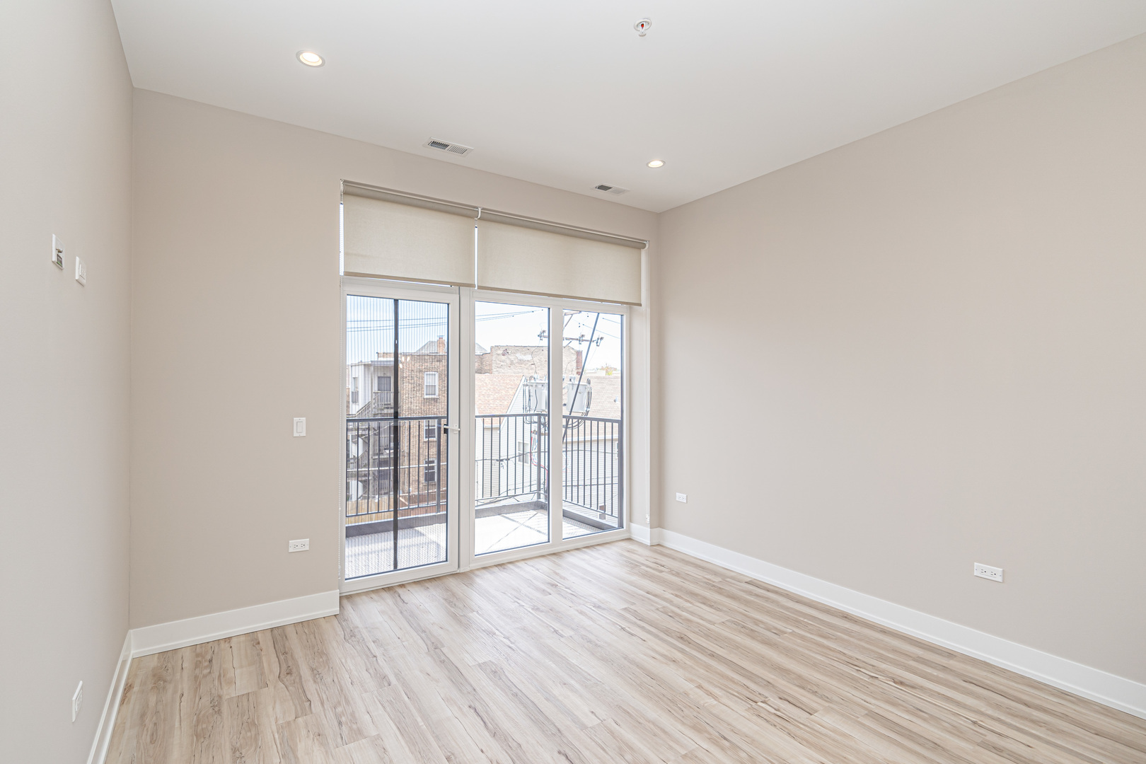 4149 South Cottage Grove Avenue, Unit 305 Chicago, IL 60653 - Photo 18 of 27 wooden floor in an empty room with a window