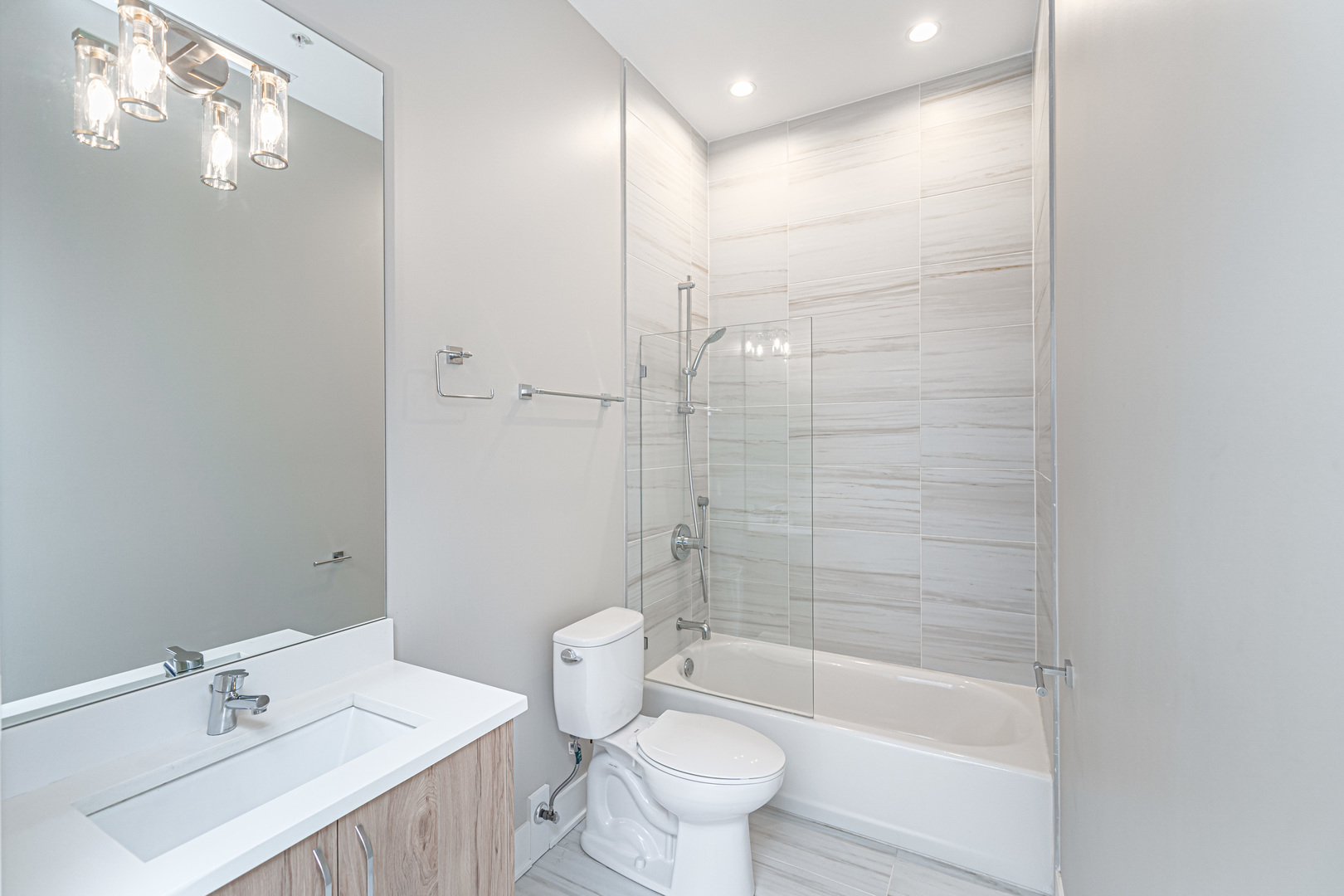 4149 South Cottage Grove Avenue, Unit 305 Chicago, IL 60653 - Photo 23 of 27 a bathroom with a sink toilet and shower