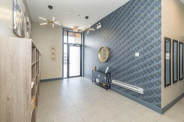 a view of a hallway to closet and a window