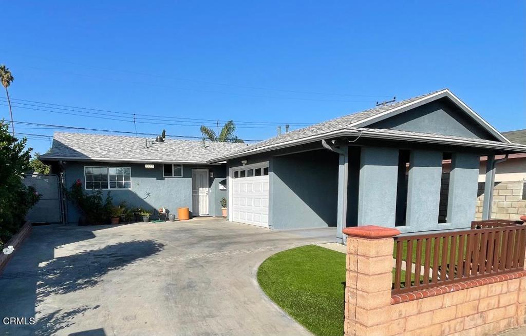 1501 Morris Street Oxnard, CA 93030 - Photo 1 of 34 a front view of a house with garage