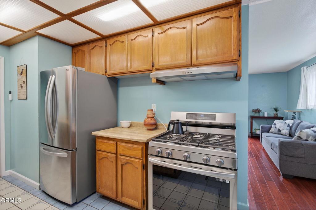 1501 Morris Street Oxnard, CA 93030 - Photo 13 of 34 a kitchen with stainless steel appliances granite countertop a refrigerator sink and stove