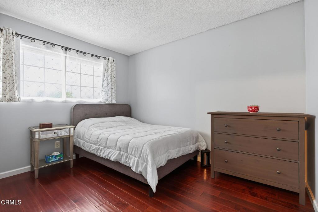 1501 Morris Street Oxnard, CA 93030 - Photo 19 of 34 a bedroom with a bed and a dresser