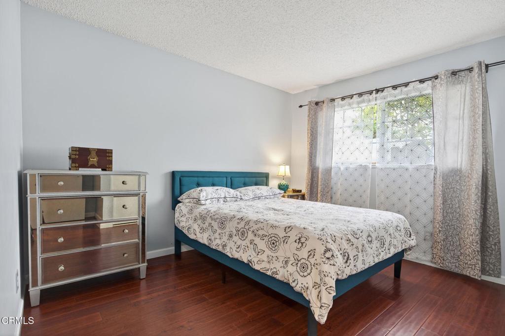 1501 Morris Street Oxnard, CA 93030 - Photo 20 of 34 a bedroom with a bed and a dresser