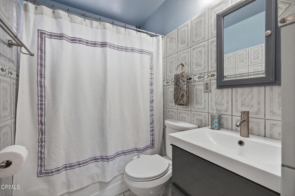1501 Morris Street Oxnard, CA 93030 - Photo 21 of 34 a bathroom with a sink a toilet and shower
