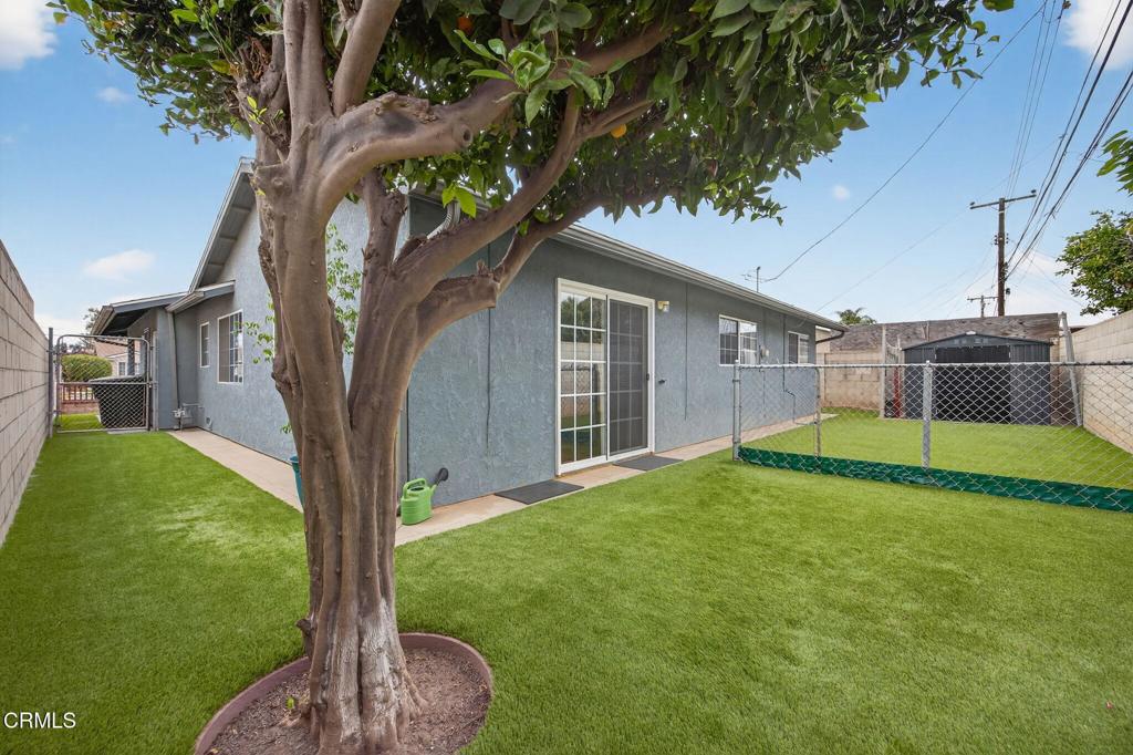 1501 Morris Street Oxnard, CA 93030 - Photo 30 of 34 a view of a house with backyard and a tree
