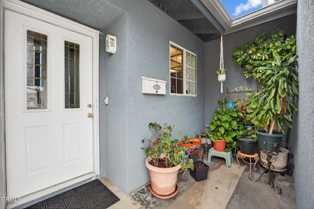 1501 Morris Street Oxnard, CA 93030 - Photo 7 of 34 a view of a entryway with flower pots