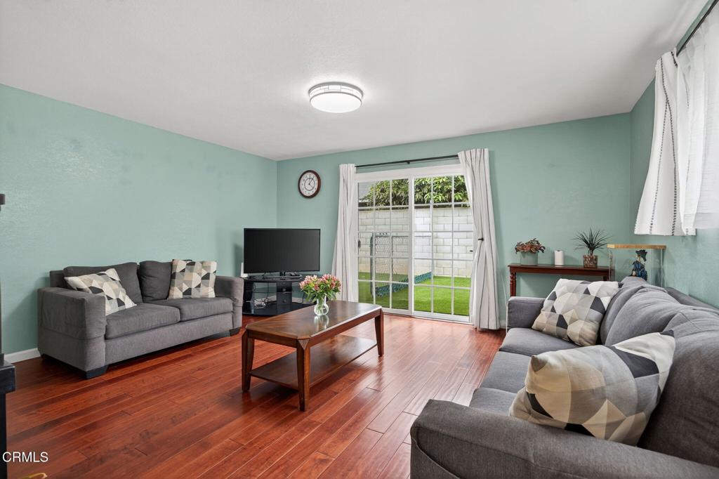 1501 Morris Street Oxnard, CA 93030 - Photo 9 of 34 a living room with furniture and a flat screen tv