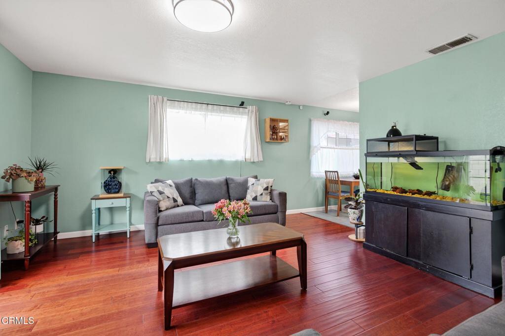 1501 Morris Street Oxnard, CA 93030 - Photo 10 of 34 a living room with furniture and a wooden floor