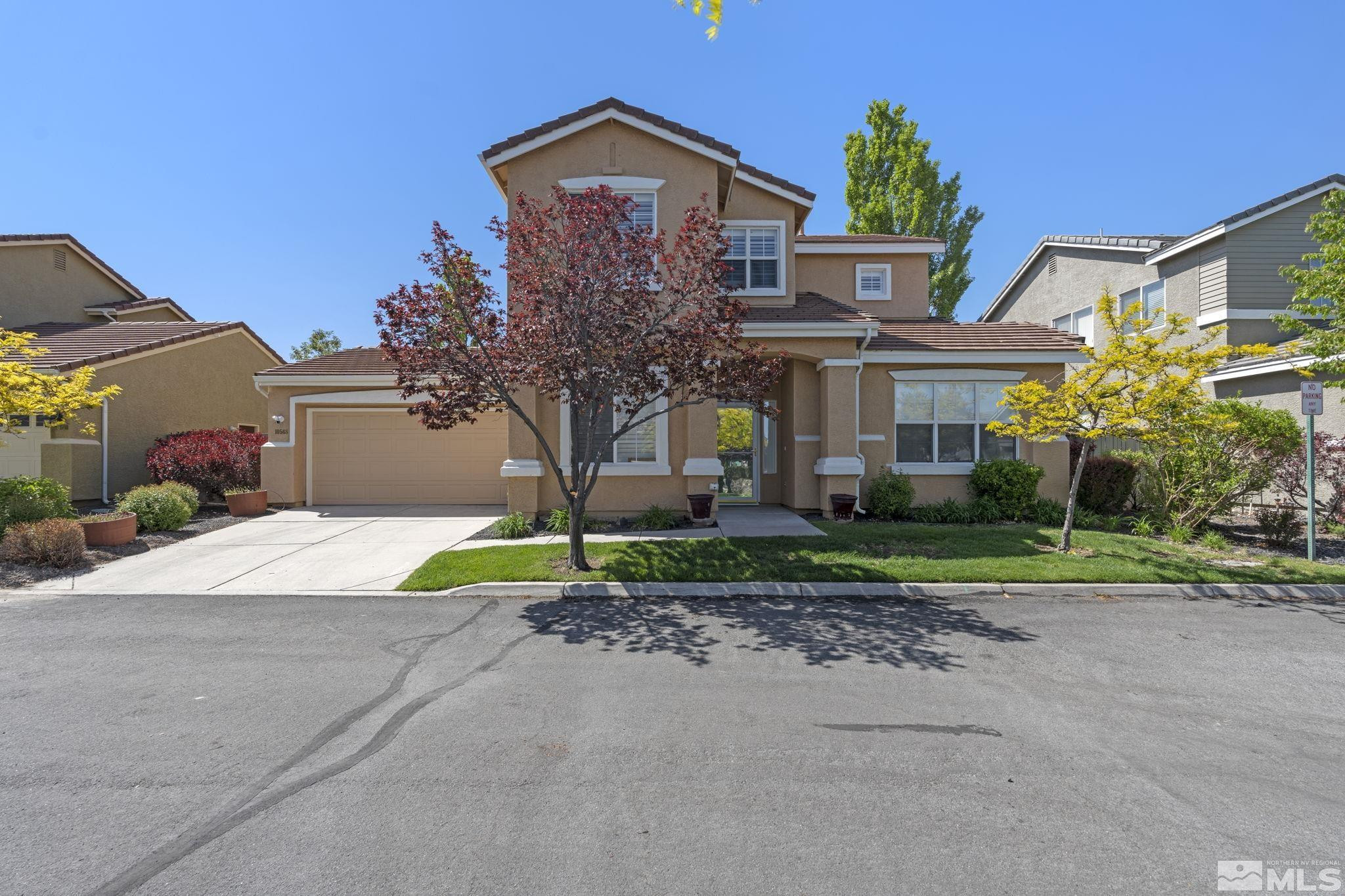 10568 Iron Point Circle Reno, NV 89521 - Photo 1 of 30 a front view of house with yard and green space