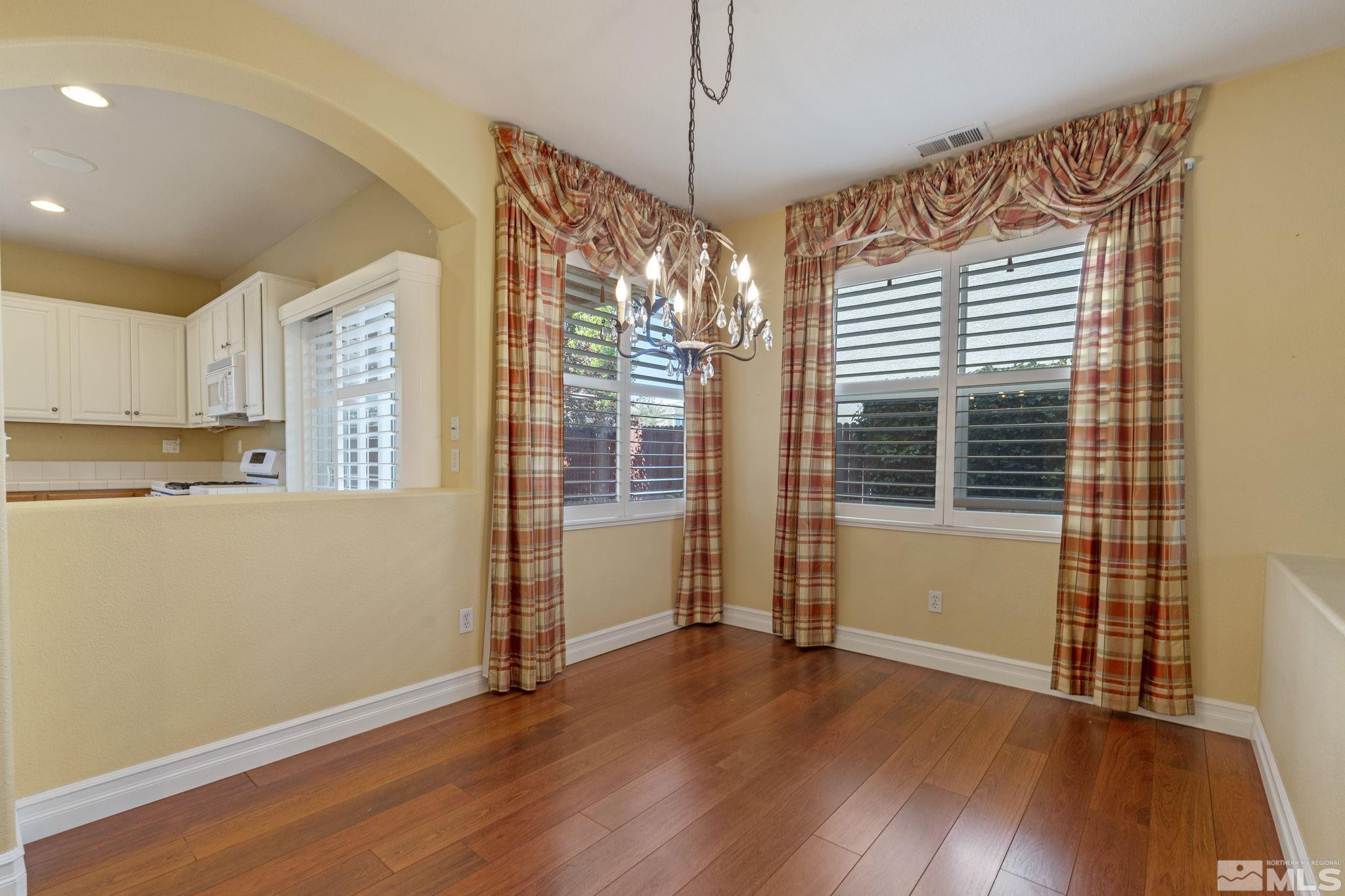 10568 Iron Point Circle Reno, NV 89521 - Photo 11 of 30 a view of a kitchen with wooden floor and windows