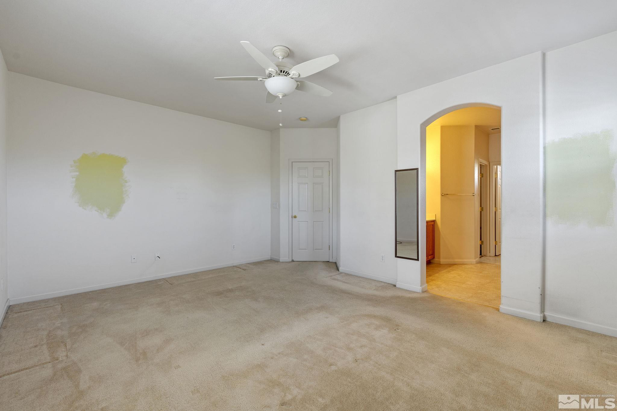 10568 Iron Point Circle Reno, NV 89521 - Photo 18 of 30 an empty room with a ceiling fan and a window