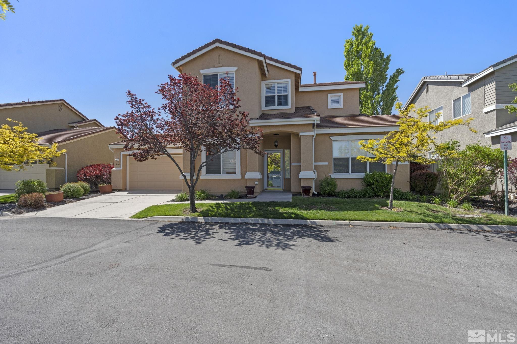10568 Iron Point Circle Reno, NV 89521 - Photo 2 of 30 a view of house with street and trees