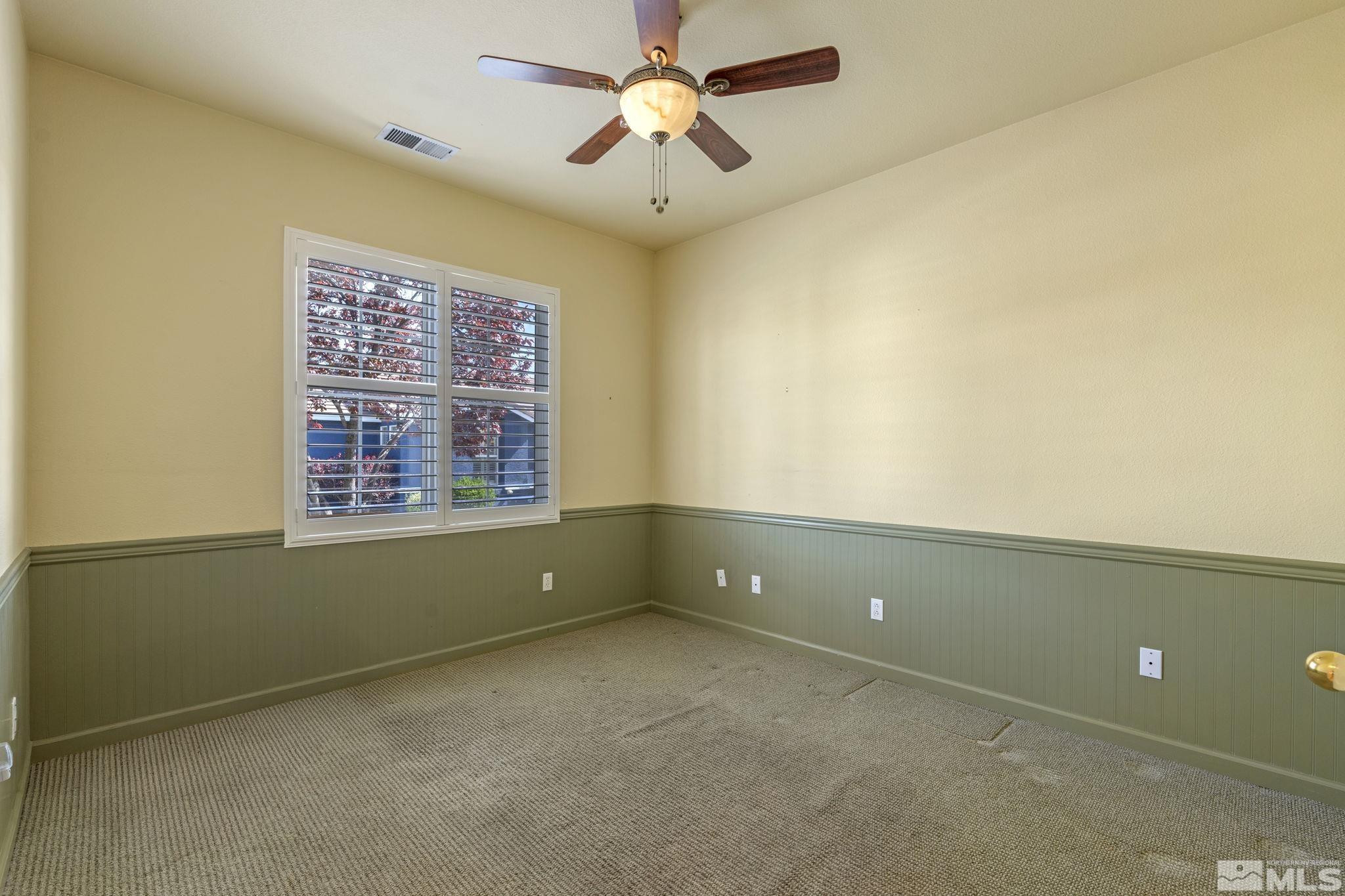 10568 Iron Point Circle Reno, NV 89521 - Photo 23 of 30 a view of an empty room with a window