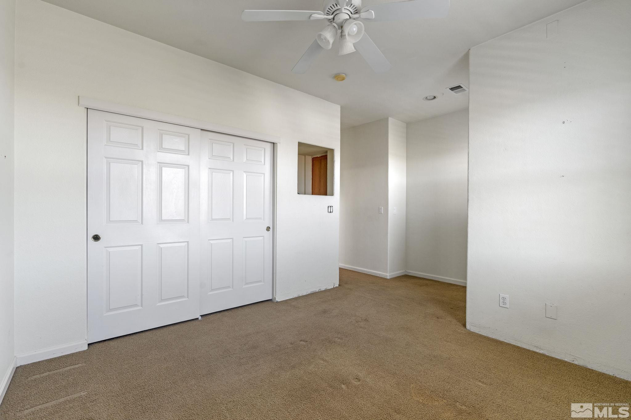 10568 Iron Point Circle Reno, NV 89521 - Photo 24 of 30 an empty room with a bathroom