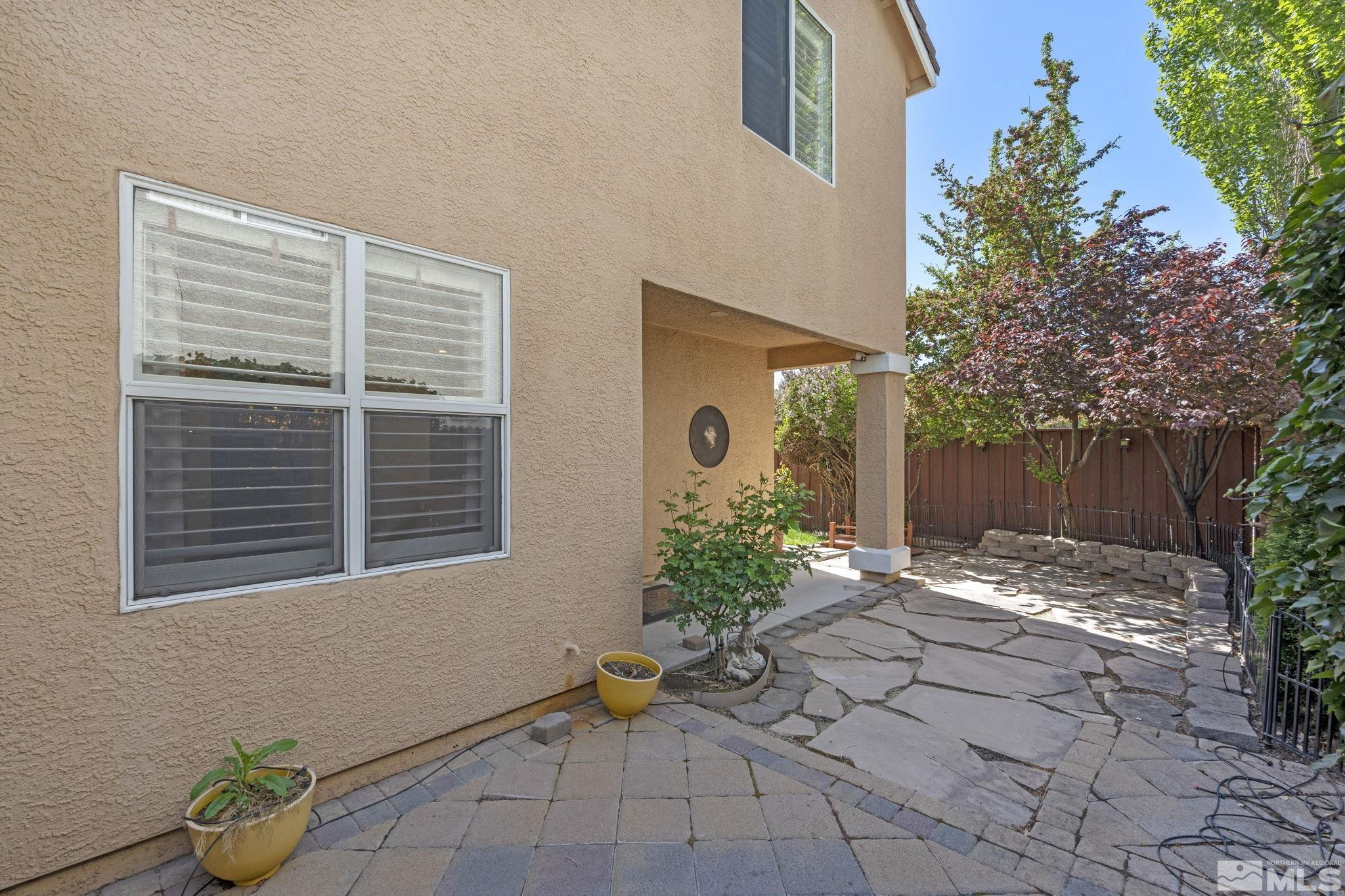 10568 Iron Point Circle Reno, NV 89521 - Photo 28 of 30 a backyard of a house with outdoor seating