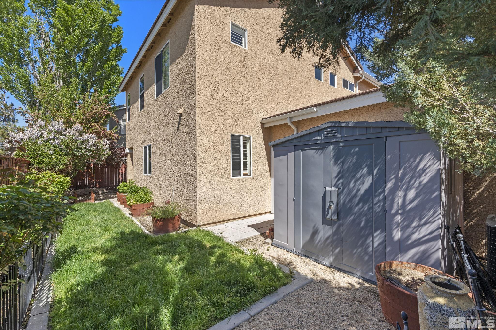 10568 Iron Point Circle Reno, NV 89521 - Photo 29 of 30 a backyard of a house with lots of green space