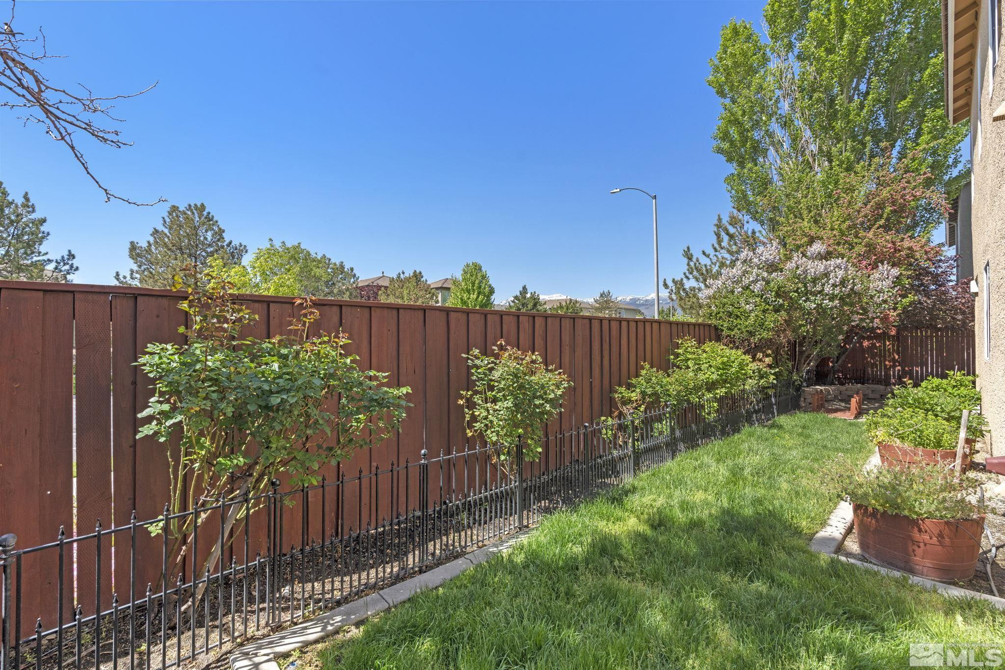 10568 Iron Point Circle Reno, NV 89521 - Photo 30 of 30 a view of a backyard with wooden fence
