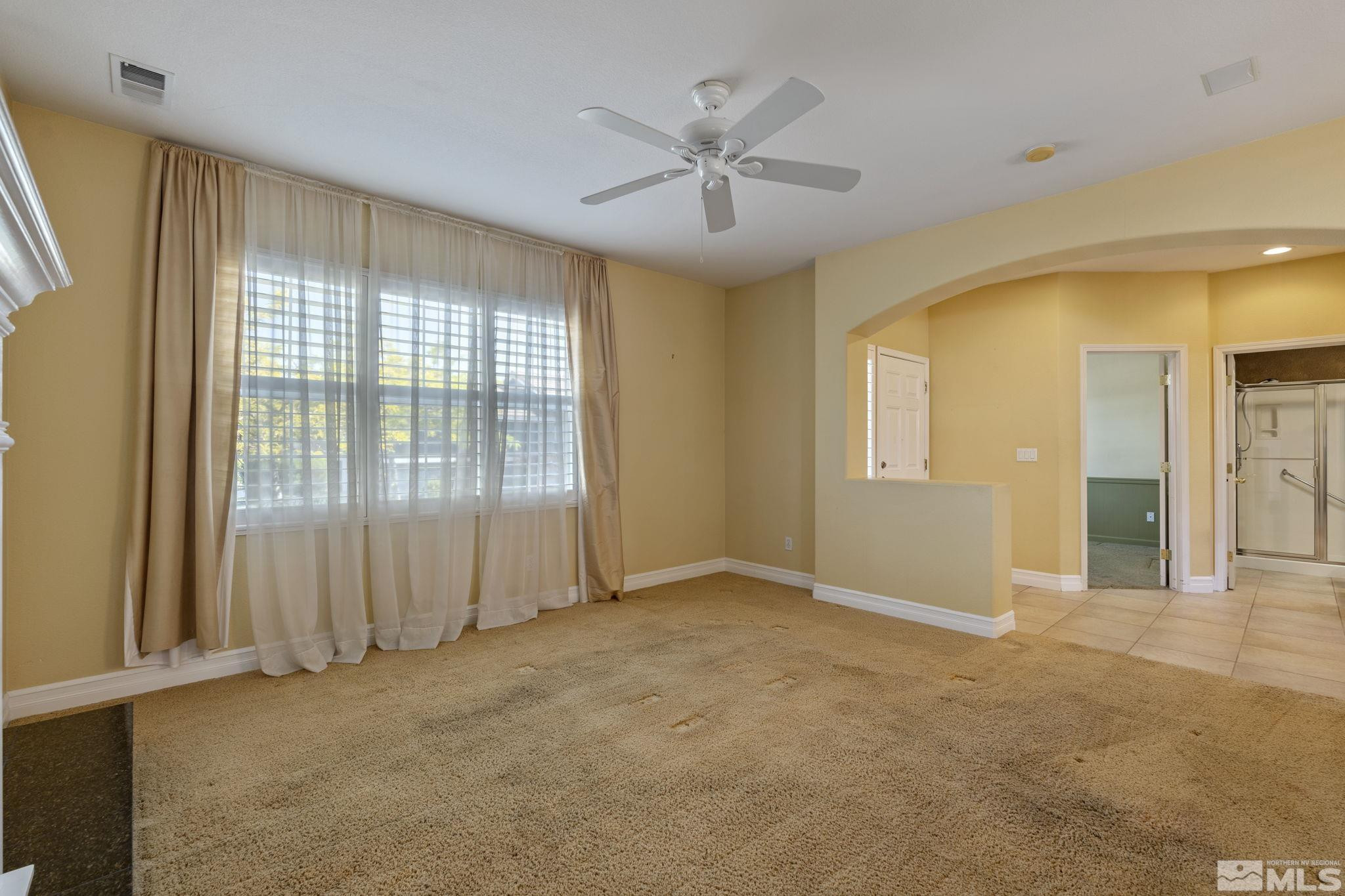 10568 Iron Point Circle Reno, NV 89521 - Photo 4 of 30 a view of an empty room with a window