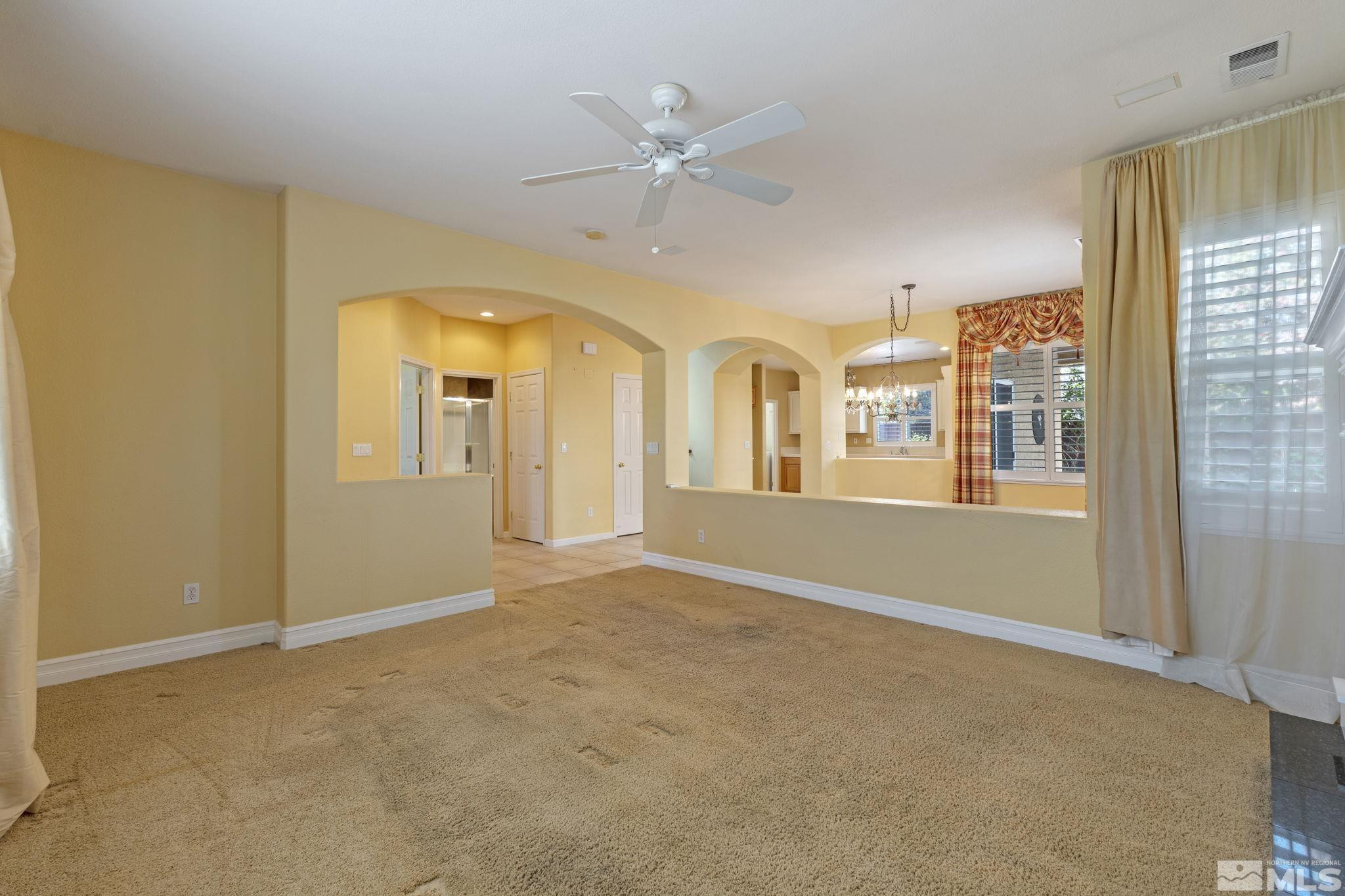 10568 Iron Point Circle Reno, NV 89521 - Photo 6 of 30 a view of an empty room with a window