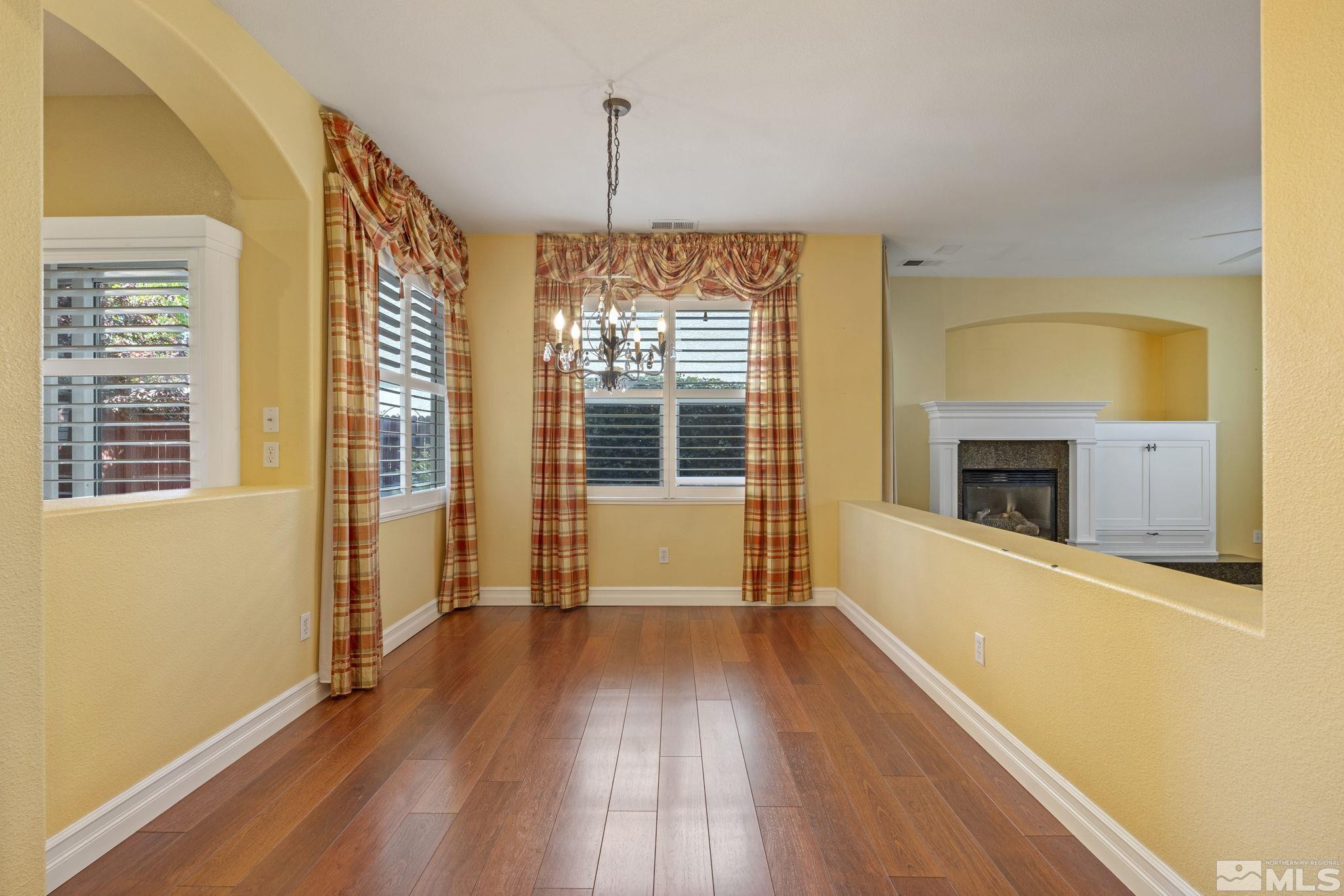 10568 Iron Point Circle Reno, NV 89521 - Photo 9 of 30 a view of a room with wooden floor and a window
